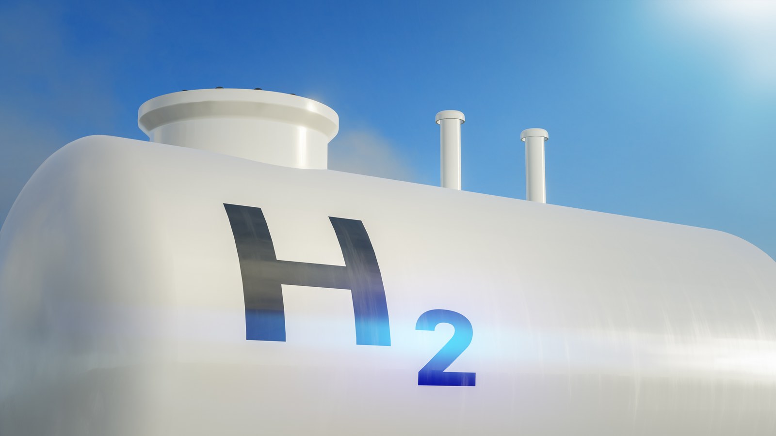 A hydrogen storage tank marked H2 against a clear sky